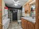 Bathroom with glass block shower, wood vanity, and black marble flooring at 4344 Cr 542H, Bushnell, FL 33513
