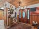 Inviting entryway with wood-paneled walls and rustic decor at 4344 Cr 542H, Bushnell, FL 33513