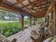 Relaxing porch with rocking chairs overlooking a tranquil garden at 4344 Cr 542H, Bushnell, FL 33513