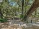 Relaxing stone patio garden nestled under large oak trees at 4344 Cr 542H, Bushnell, FL 33513