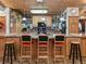 Island kitchen with wood cabinets, granite countertops, and breakfast bar at 4344 Cr 542H, Bushnell, FL 33513
