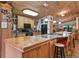 Eat-in kitchen with wood cabinets, granite countertops, and modern appliances at 4344 Cr 542H, Bushnell, FL 33513