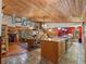 Open living room with vaulted ceiling, wood floors and kitchen at 4344 Cr 542H, Bushnell, FL 33513