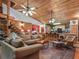 Spacious living room with vaulted wood ceilings, a cozy sitting area and hardwood floors at 4344 Cr 542H, Bushnell, FL 33513