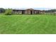 Large grassy paddock with barn in the background at 4344 Cr 542H, Bushnell, FL 33513
