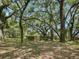 Wooded pasture with a rustic wooden fence at 4344 Cr 542H, Bushnell, FL 33513