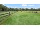 Serene pasture with wooden fence and lush green grass at 4344 Cr 542H, Bushnell, FL 33513