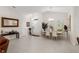Dining area adjacent to the entryway, featuring a large table with chairs at 5005 Sw 106Th St, Ocala, FL 34476