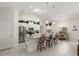 Modern kitchen with white cabinets, granite countertops, and stainless steel appliances at 5005 Sw 106Th St, Ocala, FL 34476