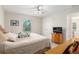 King bedroom with wood furniture, ceiling fan, and a TV at 5005 Sw 106Th St, Ocala, FL 34476