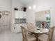 Breakfast nook with glass-top table and four chairs at 5005 Sw 106Th St, Ocala, FL 34476