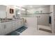 Large bathroom with double vanity, granite countertop and walk-in shower at 5005 Sw 106Th St, Ocala, FL 34476