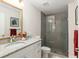 Bathroom with granite vanity, glass shower, and neutral tile at 5005 Sw 106Th St, Ocala, FL 34476