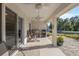 Relaxing covered patio with ceiling fans and comfortable seating at 5005 Sw 106Th St, Ocala, FL 34476