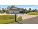 Single story house exterior with a three car garage and nicely landscaped yard at 5005 Sw 106Th St, Ocala, FL 34476