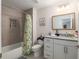 Clean bathroom with granite countertop, shower, and bathtub at 5005 Sw 106Th St, Ocala, FL 34476