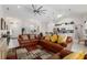 Open and airy living room with ample natural light and leather sofas at 5005 Sw 106Th St, Ocala, FL 34476
