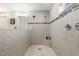 Walk-in shower with tile surround and built-in seat at 5005 Sw 106Th St, Ocala, FL 34476