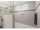 Large walk-in shower with double shower heads and tile surround at 5005 Sw 106Th St, Ocala, FL 34476