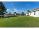 Large backyard with lush lawn and storage shed at 5005 Sw 106Th St, Ocala, FL 34476