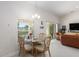 Formal dining room with travertine table and six chairs at 5005 Sw 106Th St, Ocala, FL 34476