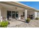 Covered patio with built-in grill and ample seating at 5005 Sw 106Th St, Ocala, FL 34476