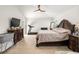 Bright bedroom with king-size bed, large dresser and a crib at 5005 Sw 106Th St, Ocala, FL 34476
