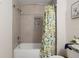 Updated bathroom with tub shower combo and lemon shower curtain at 5005 Sw 106Th St, Ocala, FL 34476