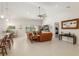 Open living room showcasing a kitchen and access to other rooms at 5005 Sw 106Th St, Ocala, FL 34476