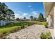 Landscaped backyard with patio and view of neighboring homes at 5005 Sw 106Th St, Ocala, FL 34476