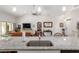 Kitchen island with granite countertops overlooks the living room at 5005 Sw 106Th St, Ocala, FL 34476