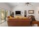 Relaxing living room with comfortable leather seating and a view to the backyard at 5005 Sw 106Th St, Ocala, FL 34476