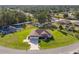 Aerial view of a single-story house with a large yard, driveway, and detached shed at 5005 Sw 106Th St, Ocala, FL 34476