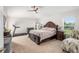 Spacious bedroom with large bed, plenty of room for workout equipment and a sitting area at 5005 Sw 106Th St, Ocala, FL 34476