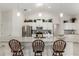 Island kitchen with granite countertops, stainless steel appliances, and white cabinets at 5005 Sw 106Th St, Ocala, FL 34476