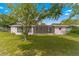 Ranch style home with a screened porch and spacious backyard at 10061 Sw 88Th Ter, Ocala, FL 34481