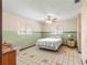 Bedroom with ceiling fan, tiled floor and window at 10061 Sw 88Th Ter, Ocala, FL 34481