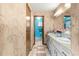 Bathroom with double vanity and access to shower at 10061 Sw 88Th Ter, Ocala, FL 34481