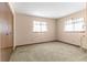 Well-lit bedroom featuring neutral walls and carpeting at 10061 Sw 88Th Ter, Ocala, FL 34481