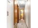 Hallway with tile flooring leading to bathroom at 10061 Sw 88Th Ter, Ocala, FL 34481