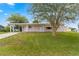 Single story home with carport and mature landscaping at 10061 Sw 88Th Ter, Ocala, FL 34481