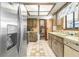 Kitchen with wood cabinets, tile floor and stainless steel appliances at 10061 Sw 88Th Ter, Ocala, FL 34481