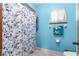 Clean bathroom with shower and floral curtain at 10061 Sw 88Th Ter, Ocala, FL 34481