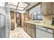Kitchen with wood cabinets, tile floor and stainless steel appliances at 10061 Sw 88Th Ter, Ocala, FL 34481