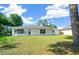 House exterior showcasing the back view and spacious yard at 13027 Ne 7Th Loop, Silver Springs, FL 34488