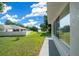 View from the house showing a tranquil lake setting beyond the fenced yard at 13027 Ne 7Th Loop, Silver Springs, FL 34488