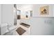 Bathroom with double sinks, a shower, and toilet at 13027 Ne 7Th Loop, Silver Springs, FL 34488