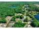 Aerial view of the property's location near a lake within a residential neighborhood at 13027 Ne 7Th Loop, Silver Springs, FL 34488
