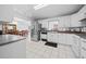 Modern kitchen with stainless steel appliances and ample cabinet space at 13027 Ne 7Th Loop, Silver Springs, FL 34488