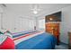 Bedroom with double bed, dresser, and ample closet space at 13027 Ne 7Th Loop, Silver Springs, FL 34488